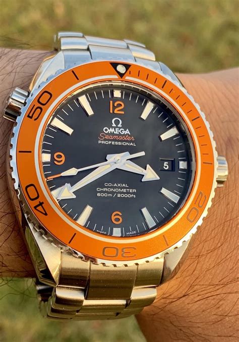 omega seamaster planet ocean cost|omega planet ocean orange bezel.